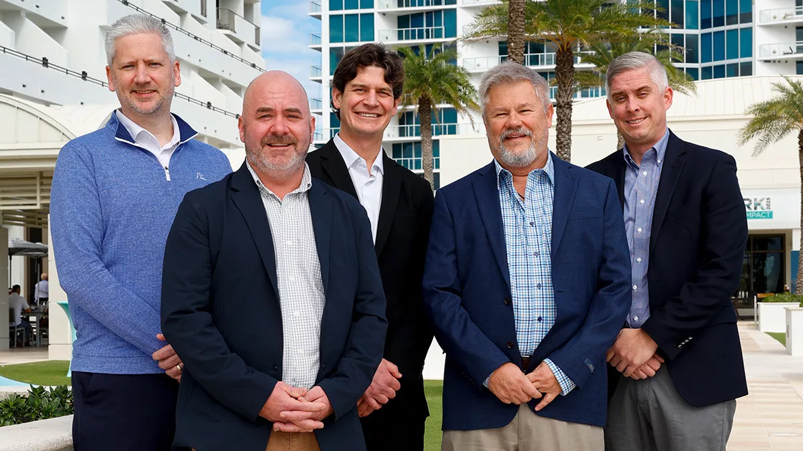 Five distributors who participated in Supply House Times’ 16th annual distributor roundtable are standing outside of a building in Fort Lauderdale, Florida.