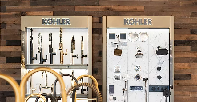 WhiteStar Supply showroom showing two Kohler displays, the left showing faucets, the right showing shower fixtures.