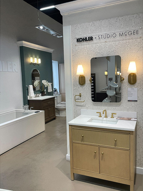 Gerhard's Kitchen & Bath Store by First Supply showcasing bathroom fixtures, a bathtub, mirrors and sinks.
