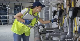 Woman Attending HVAC Unit