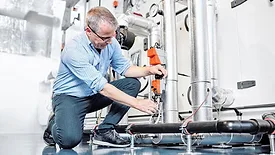 technician working on a valve