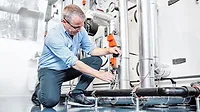 technician working on a valve technician working on a valve