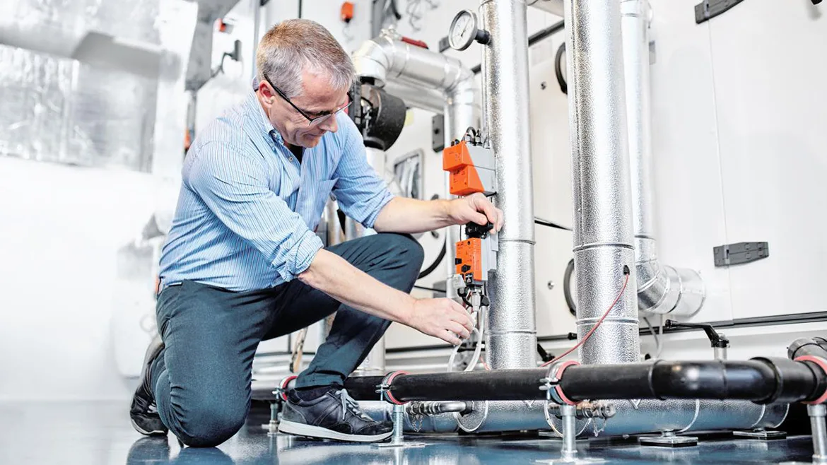 technician working on a valve technician working on a valve