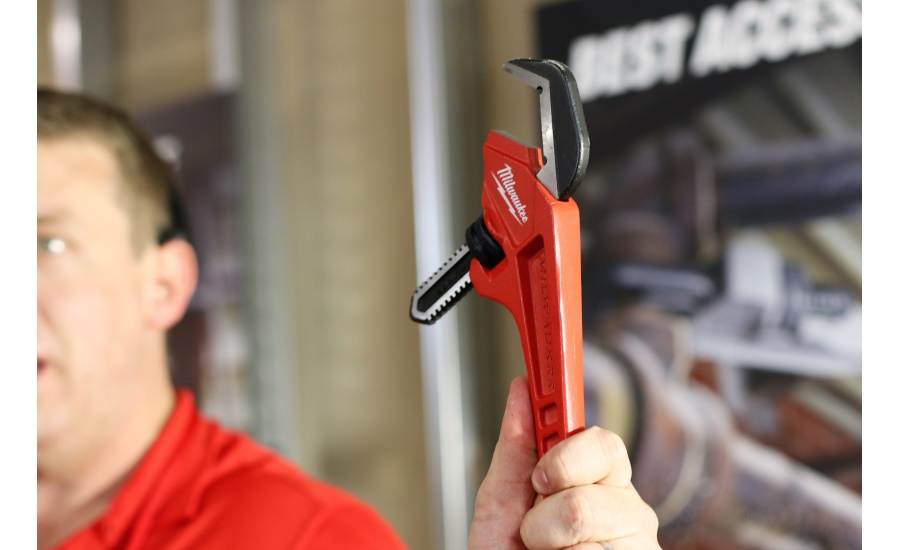 Senior Product Manager Brian Doyle shows off the newest adjustable pipe wrenches available from Milwaukee Tool during the New Product Symposium May 2 in Milwaukee.