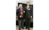 U.S. BoilerÃ¢â¬â¢s chief engineer of product development, receives an Award of Excellence.