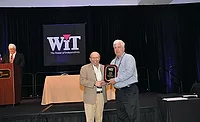WIT & Co. President Bruce Tucker (left) honors Goodin Co.’s Steve Kelly