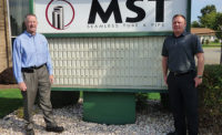 (left) and Marketing Manager Michael Perlman at company headquarters