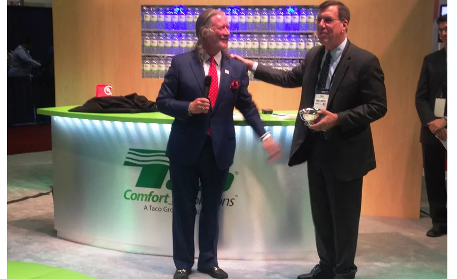 Taco President John Hazen White Jr. honors BNP columnist Dan Holohan during the 2016 AHR Expo.