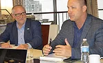 Texas Plumbing Supply’s Fuller (right) answers a question as EPSCO’s Jones looks on