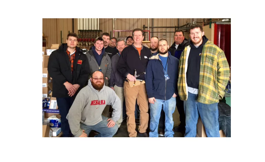 Members of Plumbers Local 370 are loading up their vehicles.