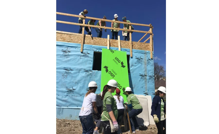 The woman-led team from Bradley Corp. assisted with installing dry wall, and raising garage walls.