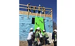 The woman-led team from Bradley Corp. assisted with installing dry wall, and raising garage walls.