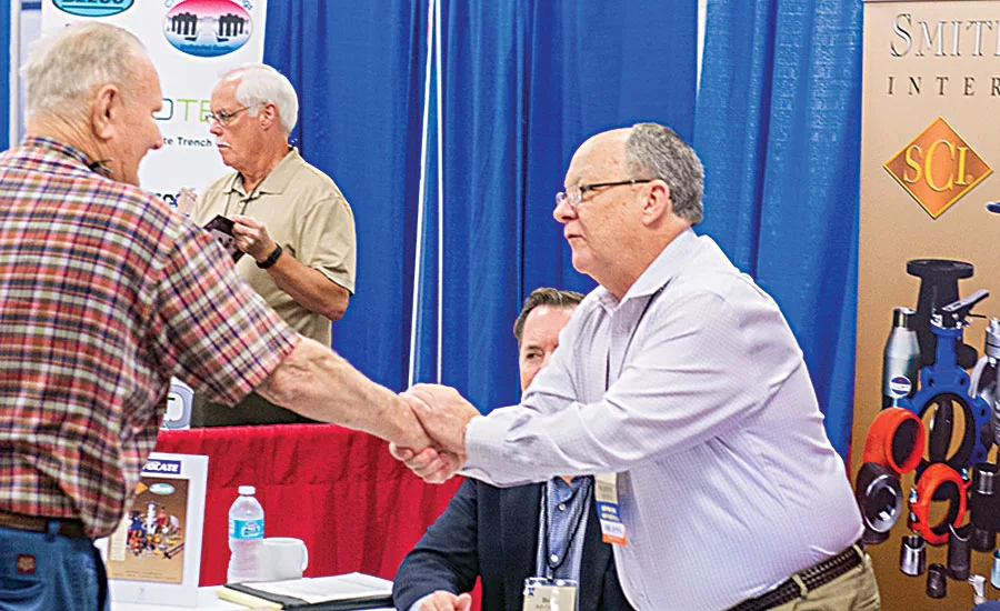 Representatives from Smith-Cooper meet with a customer 