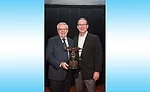 F.W. Webb’s Ernie Courtermash (left) shares his 2016 IPD Award of Excellence with Eastern Industrial Supplies’ Kip Miller