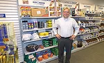 Jones Stephens Vice President of Field Sales Christopher Rohling stands in front of an MRO and contractor specialties display.