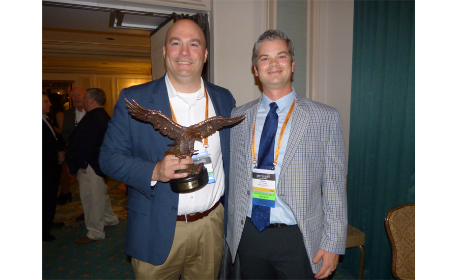 Pepco Sales Charlie Parham presents AIM/R’s prestigious Eagle Award to Uponor Vice President of Sales Brent Noonan at NETWORK2016