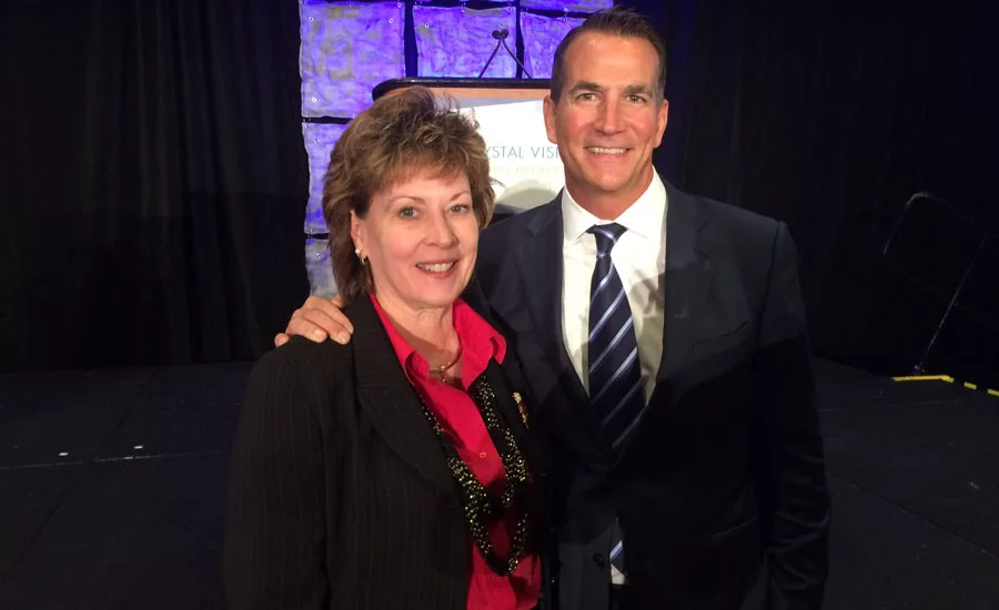PMI CEO Barbara Higgens stands with Kohler Co. President and CEO David Kohler.