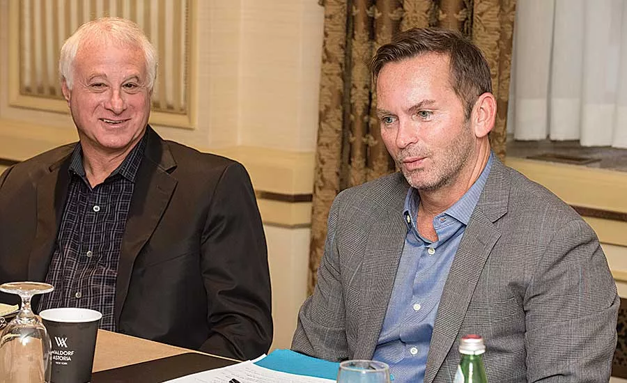 American Pipe & Supply’s John Howe contemplates a point as Wool Plumbing Supply’s Randy Wool looks on