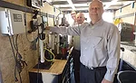 Back to front, Mark Mayer, Vollmer and Wanberg demonstrate Liberty Pumps products