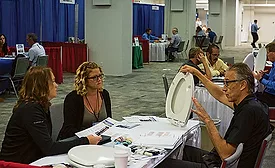 Bemis Mfg. Co.’s Randy Grebel talks to customers during a recent Equity Plumbing annual meeting