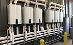 Six Navien NPE-240A tankless water heaters