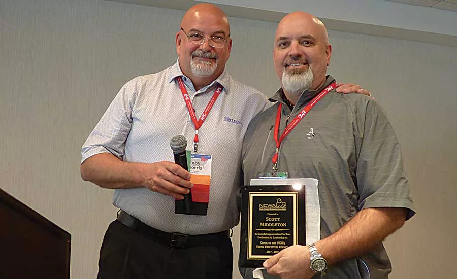 NCWA President Toby Morris (Etna Supply) honors Robertson Heating Supply’s Scott Middleton