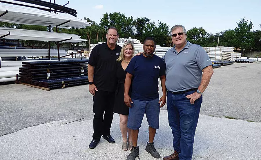 Ken Berke, Sadler, Lake Worth Warehouse Manager Milton Williams and Stuart Berke.