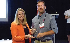 WIT Executive Vice President and COO Brandy Reed presents Cayce Mill Supply’s BJ Cayce