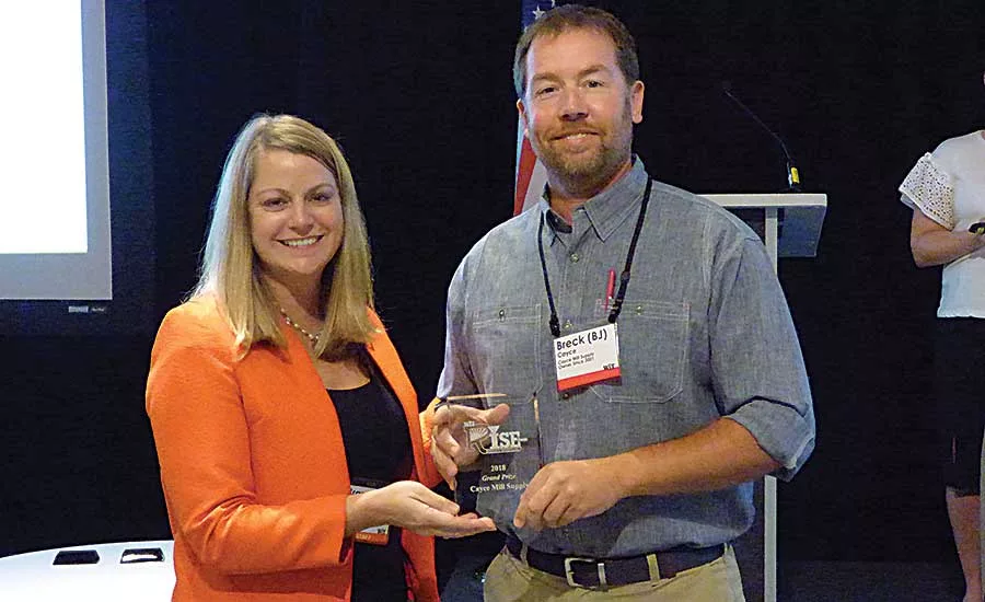 WIT Executive Vice President and COO Brandy Reed presents Cayce Mill Supply’s BJ Cayce