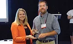 WIT Executive Vice President and COO Brandy Reed presents Cayce Mill Supply’s BJ Cayce