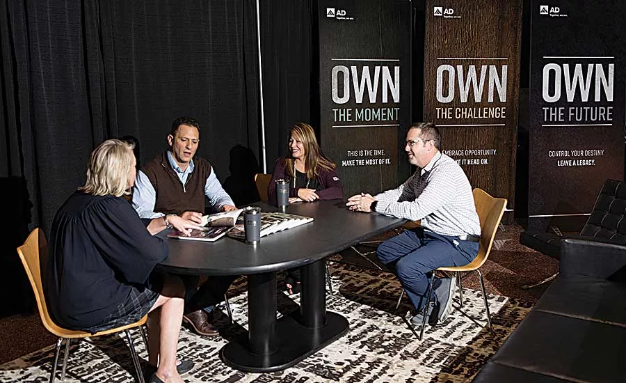 AD Decorative Brands’ Linda Hoff (left) and Stephanie Ewing (third from left) meet
