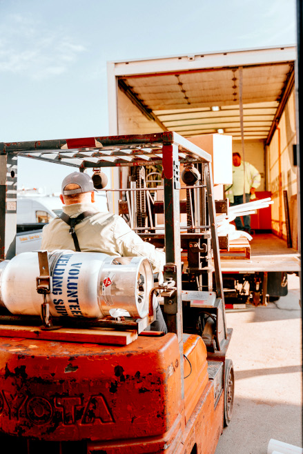 The Churches of Christ Disaster Relief Effort load boxes of supplies onto a truck bound for storm-impacted areas.