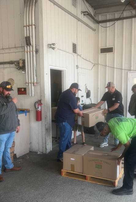Six members of Busy Bee Plumbing, Heating & Air Conditioning helping with hurricane disaster relief.